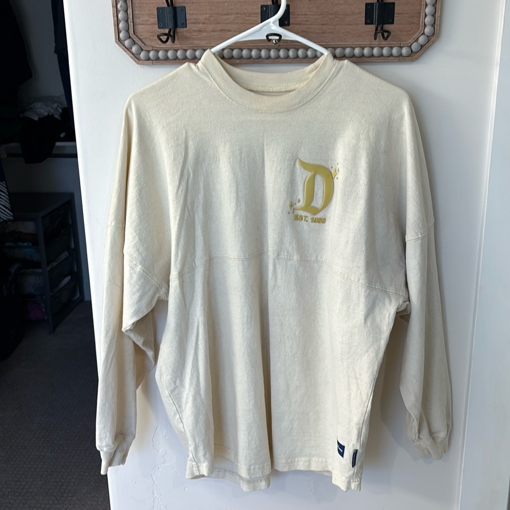 Disneyland Spirit jersey. Pale yellow with gold glitter.